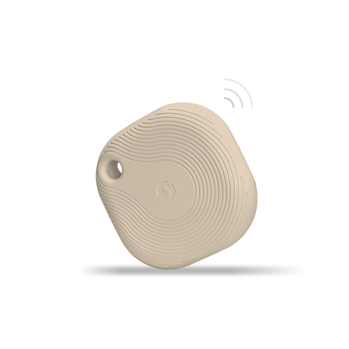 A beige, square-shaped Bluetooth tracker with rounded edges and a small hole in one corner, floating above a shadow with illustrated signal lines, on a plain light background.