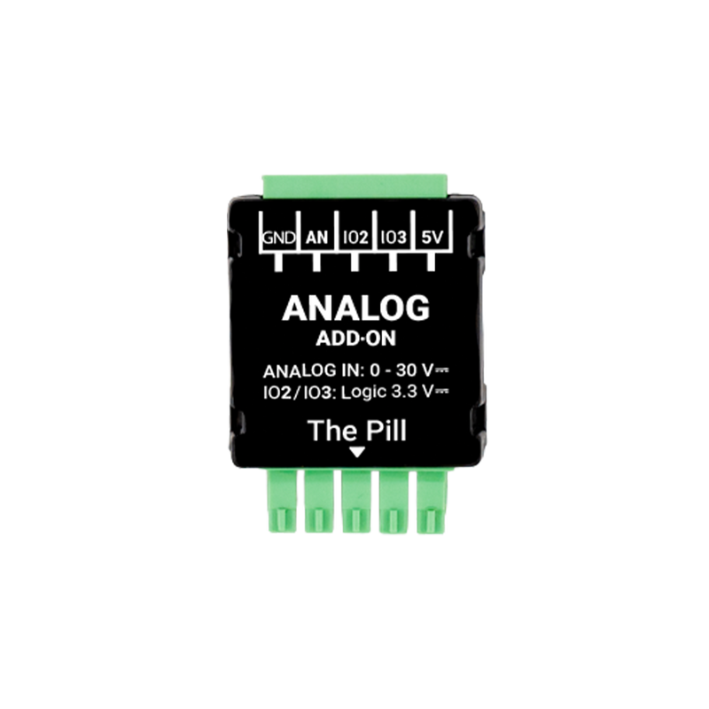 A compact black and green Analog 0 - 30V Add-on (Shelly Pill) module by Shelly USA, with labeled pins for GND, AN, IO2, IO3, and 5V, plus printed input voltage range details on its surface.