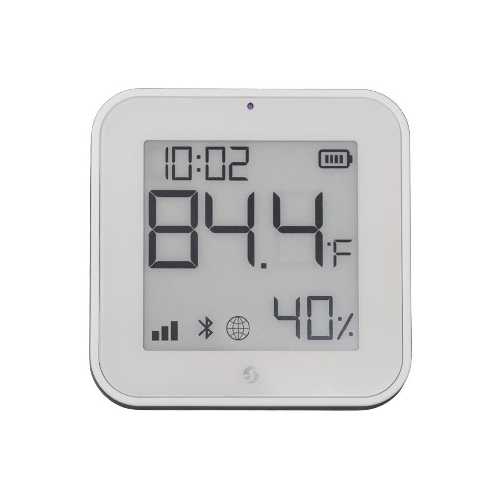 The Shelly USA Shelly BLU H&T Display ZB White shows the time (10:02), temperature (84.4°F), and humidity (40%), with battery, signal, Bluetooth, and connectivity icons on its digital screen.