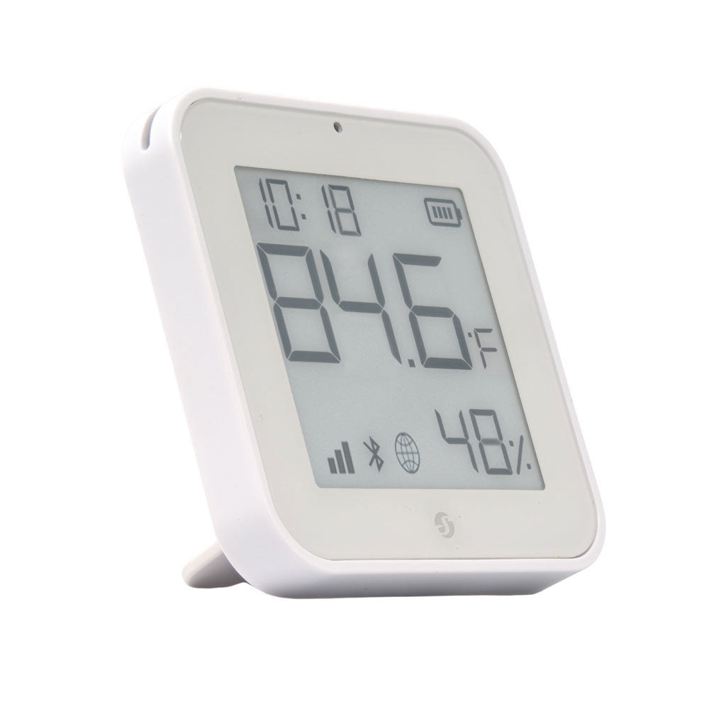 The Shelly BLU H&T Display ZB White by Shelly USA is a white digital thermometer and hygrometer showing 84.6°F, 48% humidity, icons, and a clock reading 10:18 on its screen.