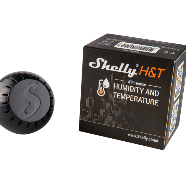A Shelly H&T Black, a WiFi-operated humidity and temperature monitor from Shelly USA, is shown with its black box packaging featuring circuit graphics and the product website—all displayed on a white background.