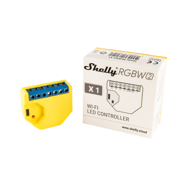 A yellow Shelly USA RGBW2 Wi-Fi LED controller for smart strips is displayed beside its white retail box featuring product branding and specifications.