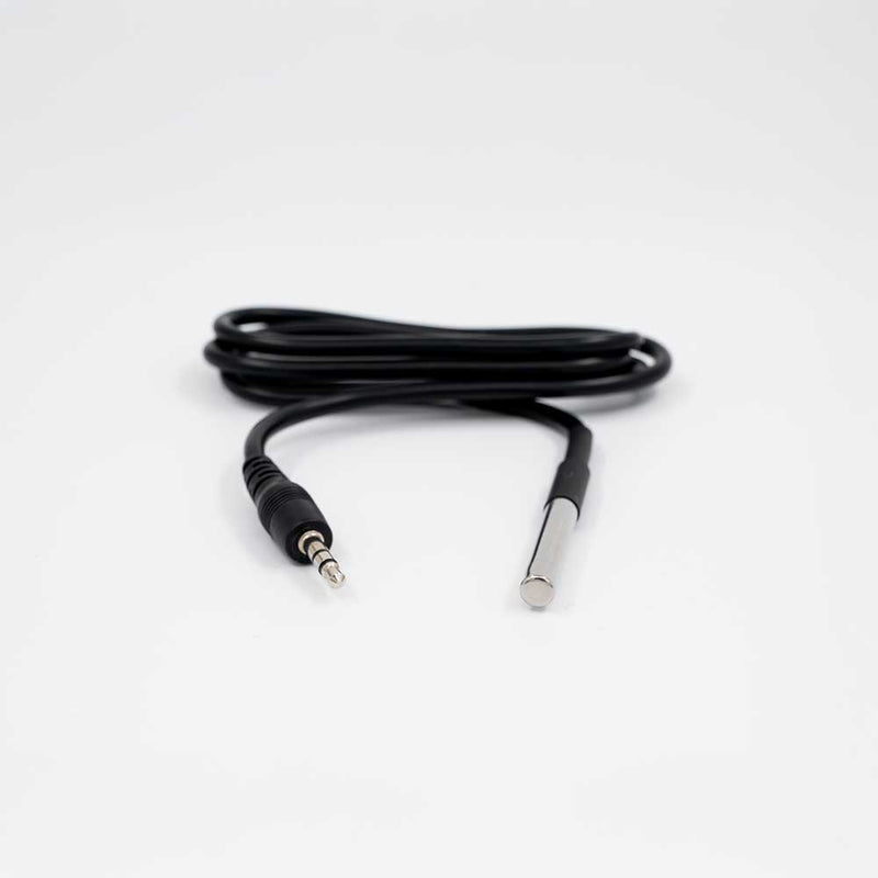 The Shelly Europe Temp. Sensor DS18B20 features a black cable with a 3.5mm audio jack on one end and a slim metallic sensor on the other, shown coiled against a white background.