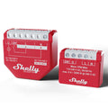 Two red Shelly USA Wave 1PM Mini smart relay modules with white labeling display input/output terminals and AC/DC voltage and current specs, placed side by side on a white background.