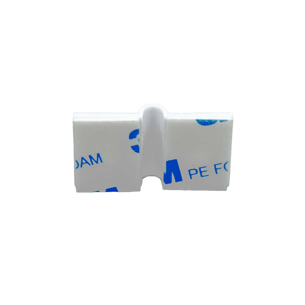The Shelly Cable Bracket 10-pack from Shelly Europe is a white plastic clip with adhesive foam pads on each side, blue text, and partial 3M branding, designed for mounting objects.