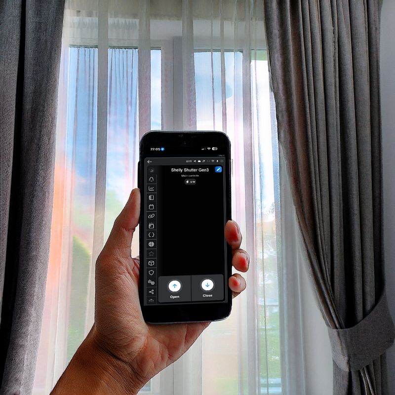 A hand holds a smartphone displaying the Shelly Shutter + BLU Button Tough1 Pack app by Shelly USA in front of a window with sheer curtains and gray drapes, showing controls to open or close the shades.